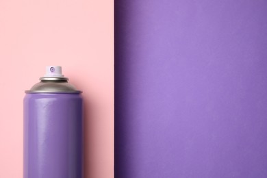 Photo of Can of spray paint on color background, top view with space for text. Graffiti supply