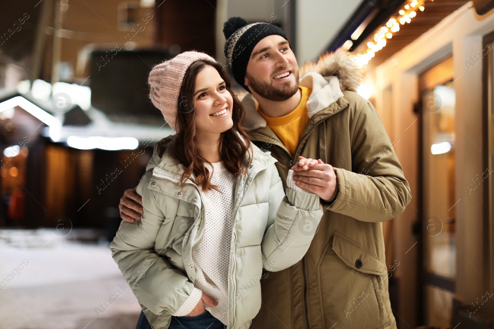 Photo of Lovely couple on city street. Winter vacation