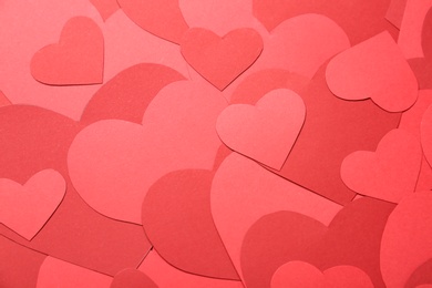 Photo of Beautiful red paper hearts as background, closeup