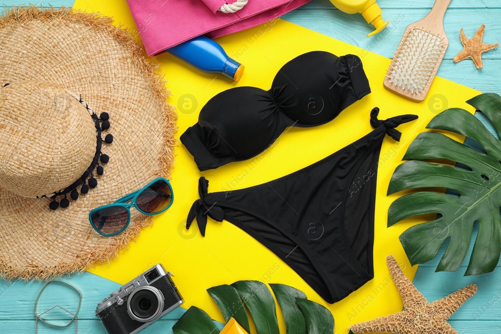 Photo of Flat lay composition with beach accessories on colorful background