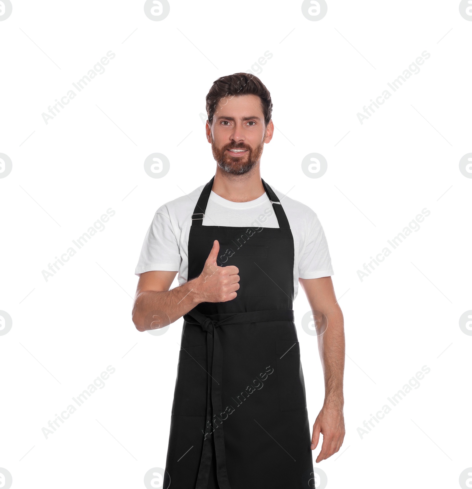 Photo of Professional hairdresser wearing apron showing thumb up on white background