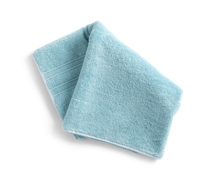 Photo of Folded soft terry towel on white background, top view