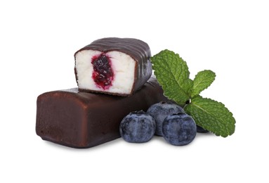 Photo of Cut and whole glazed curds with blueberry filling isolated on white