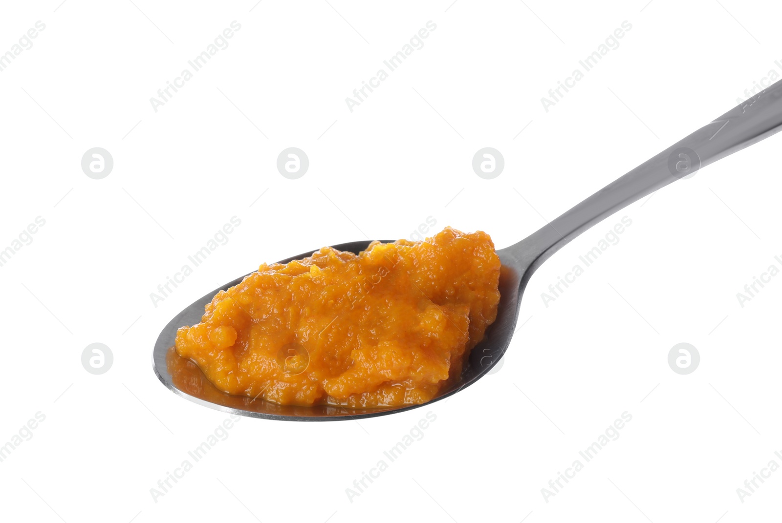 Photo of Spoon with orange tasty puree on white background