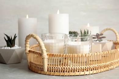 Photo of Beautiful composition with burning candles on table