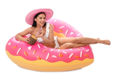 Photo of Beautiful young woman in stylish bikini with cocktail and inflatable ring on white background