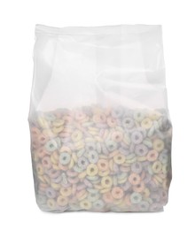 Photo of Tasty cereal rings in transparent plastic pack isolated on white