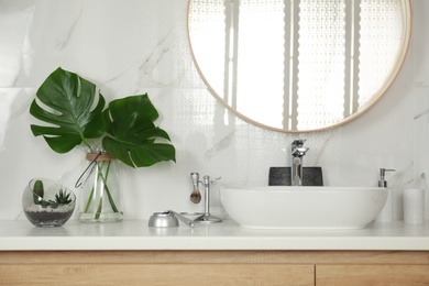 Photo of Stylish bathroom interior with vessel sink and decor elements