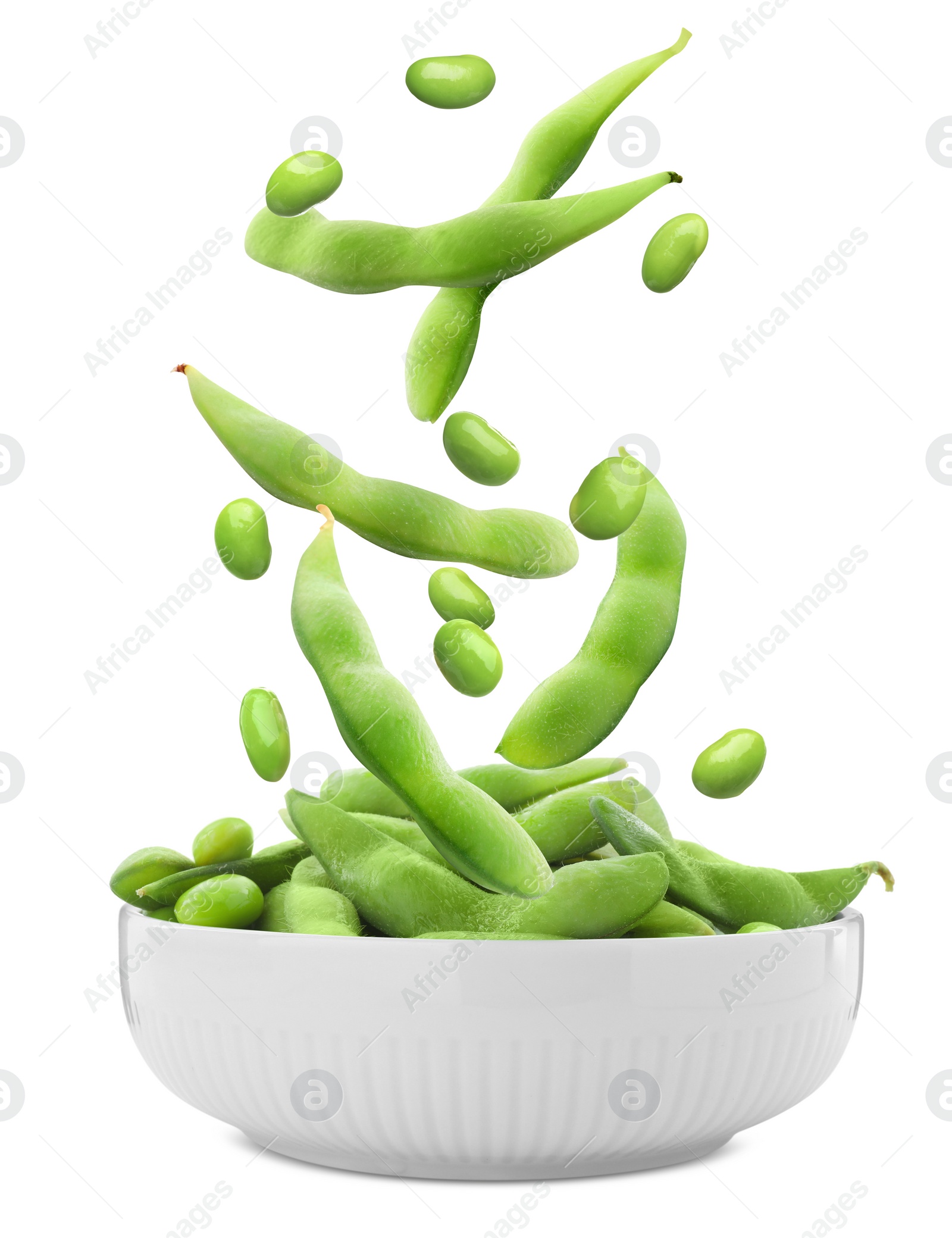 Image of Fresh edamame soybeans and pods falling into bowl on white background