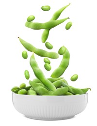 Image of Fresh edamame soybeans and pods falling into bowl on white background