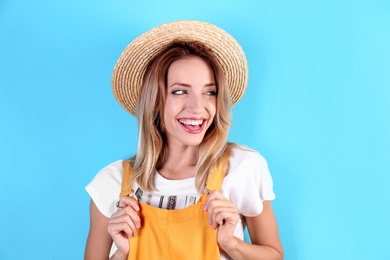 Photo of Portrait of beautiful laughing woman on color background