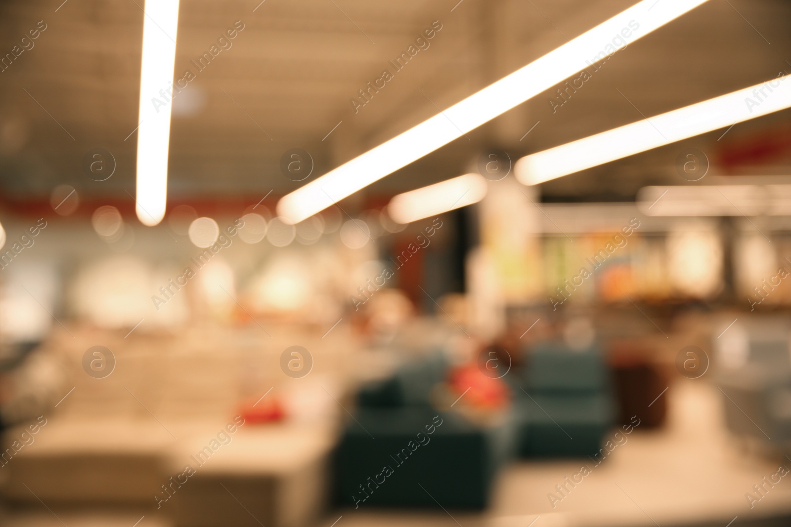 Photo of Blurred view of modern shopping mall interior