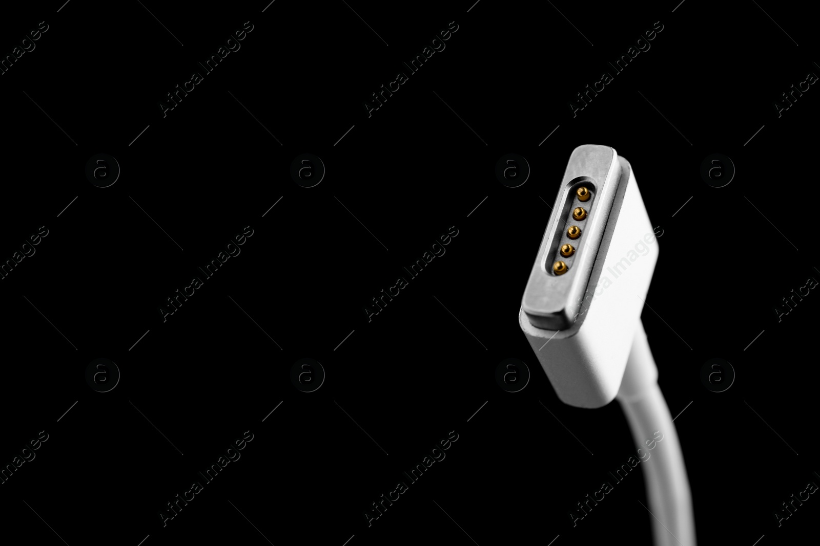 Photo of Charge cable on black background, closeup. Space for text