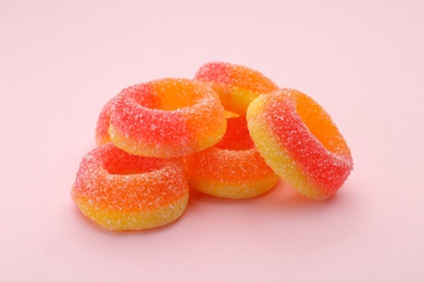 Photo of Pile of tasty jelly candies on color background