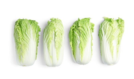 Photo of Fresh ripe cabbages on white background