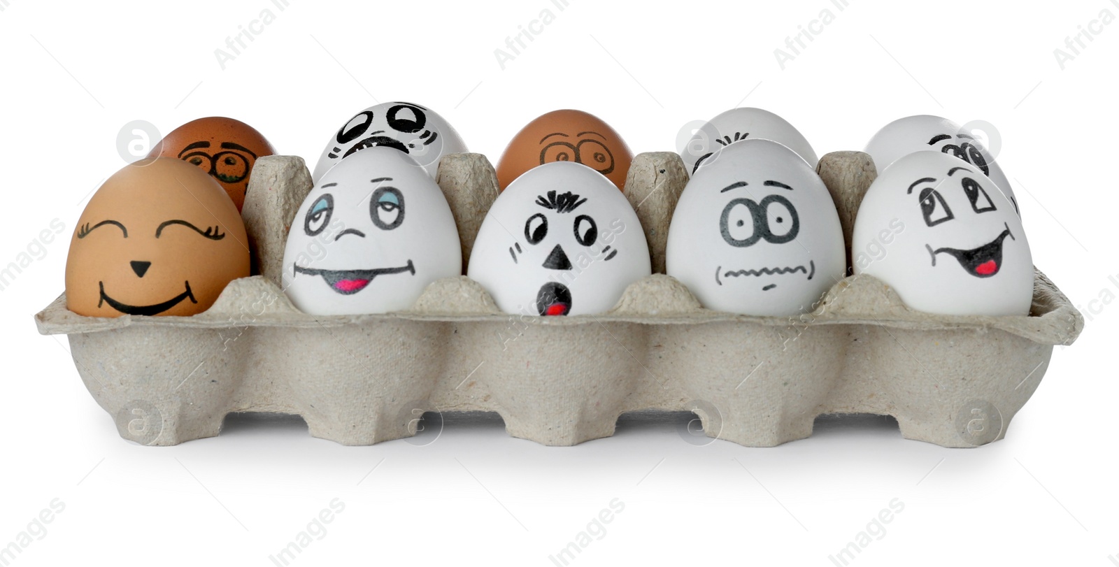 Photo of Eggs with different drawn faces in cardboard package on white background