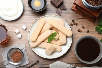 Flat lay composition with ingredients for tiramisu on wooden table