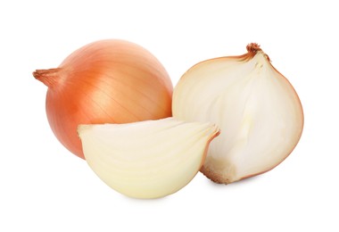 Photo of Whole and cut onions on white background