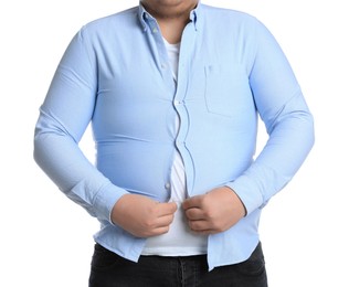 Overweight man trying to button up tight shirt on white background, closeup