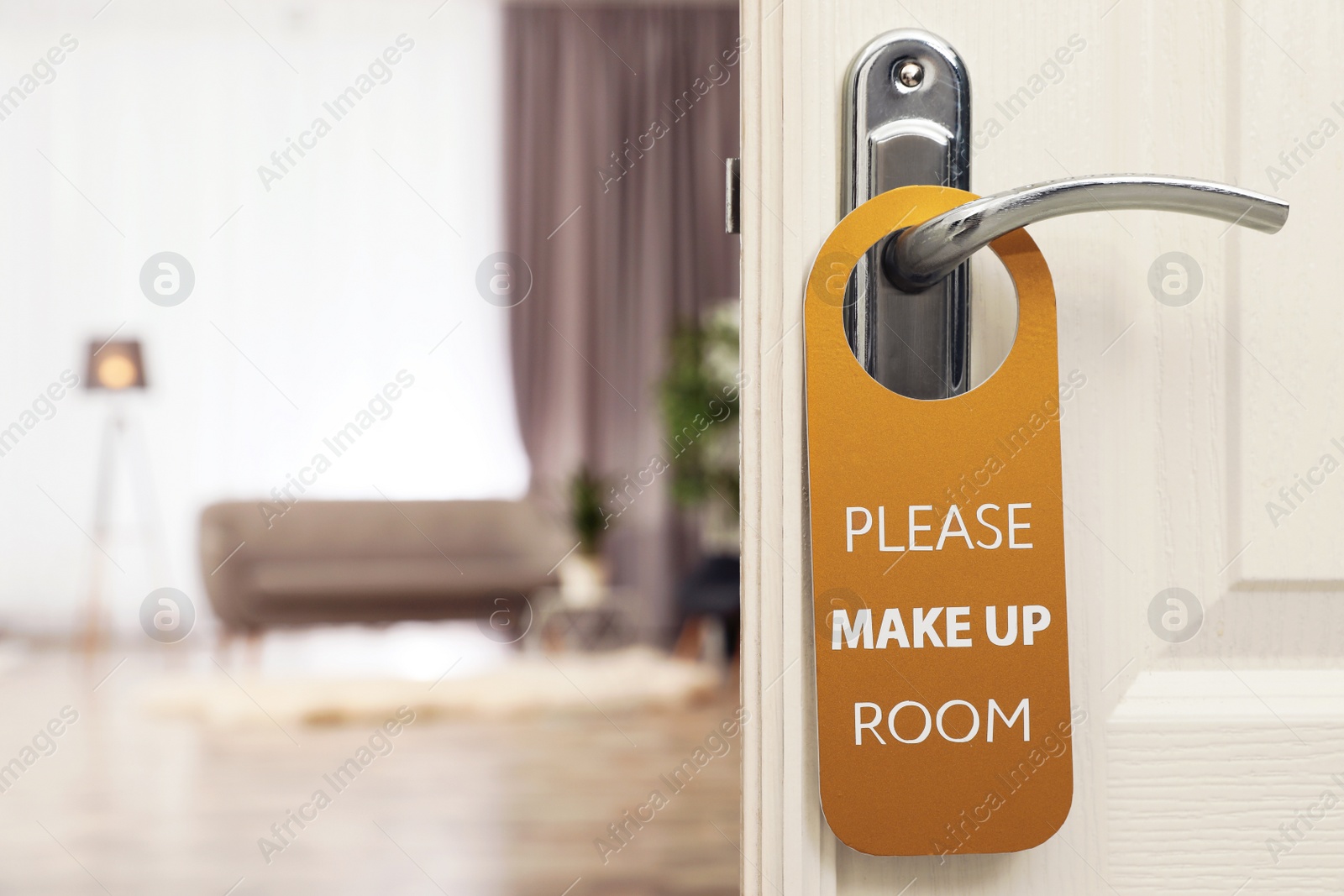 Photo of Open door with sign PLEASE MAKE UP ROOM on handle at hotel, space for text