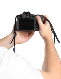 Photographer holding modern camera on white background, closeup