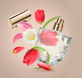 Image of Bottle of perfume and tulips in air on dark beige background