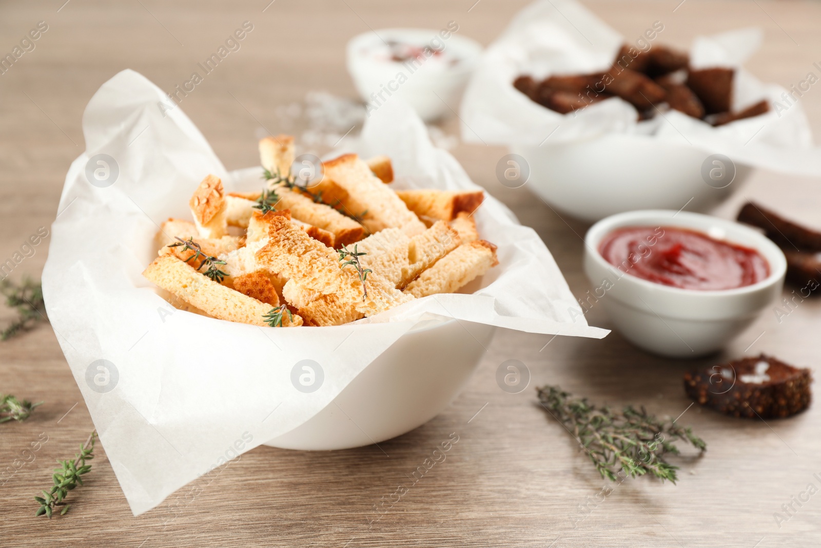 Photo of Delicious hard chucks in bowl on wooden table