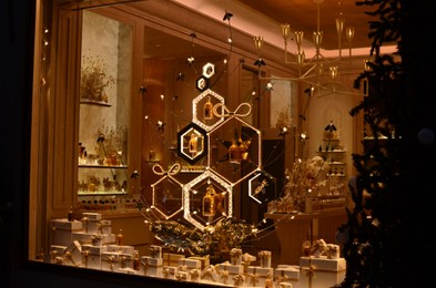 Photo of Paris, France - December 10, 2022: Beautiful perfume store display with gift boxes