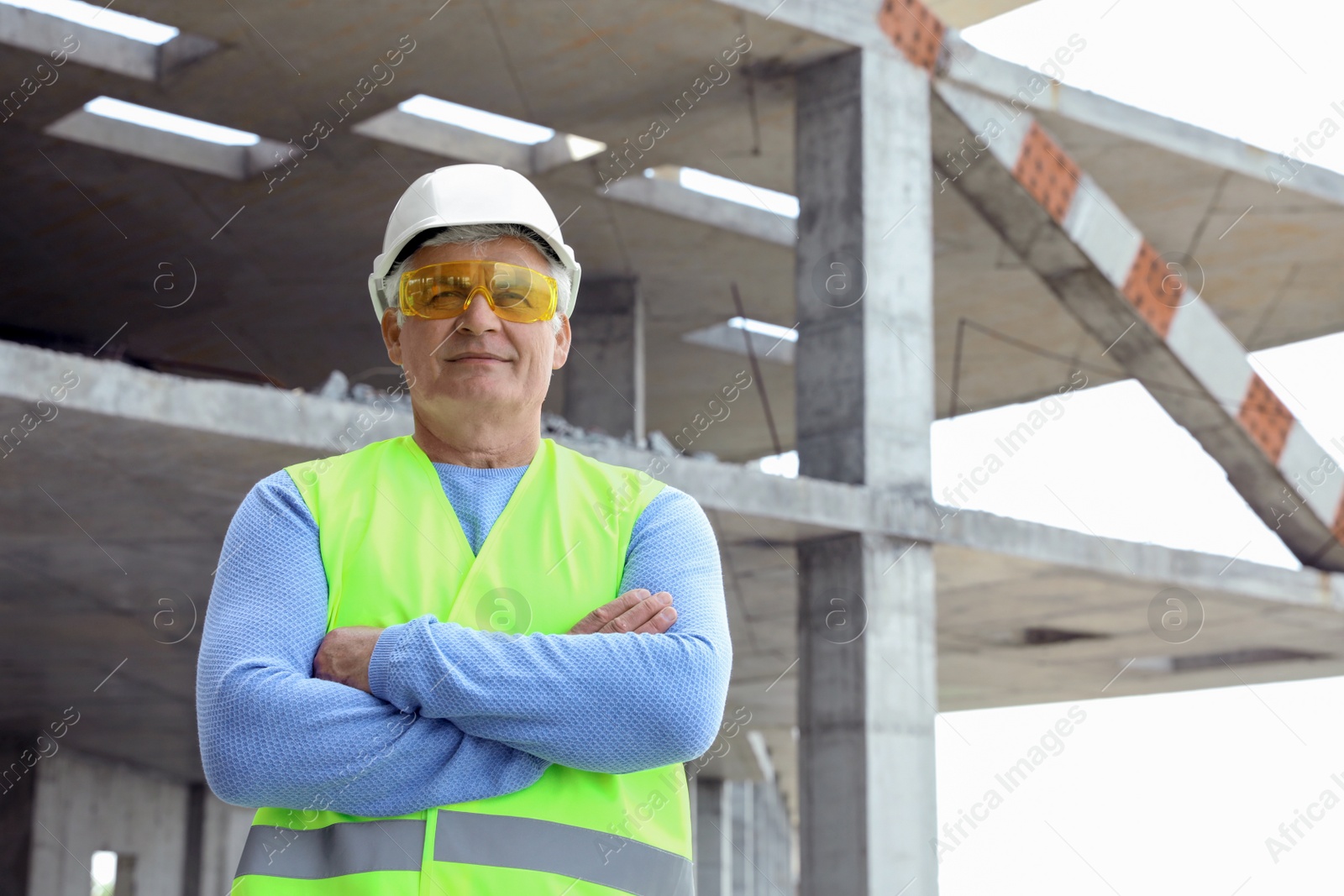 Photo of Professional engineer in safety equipment at construction site