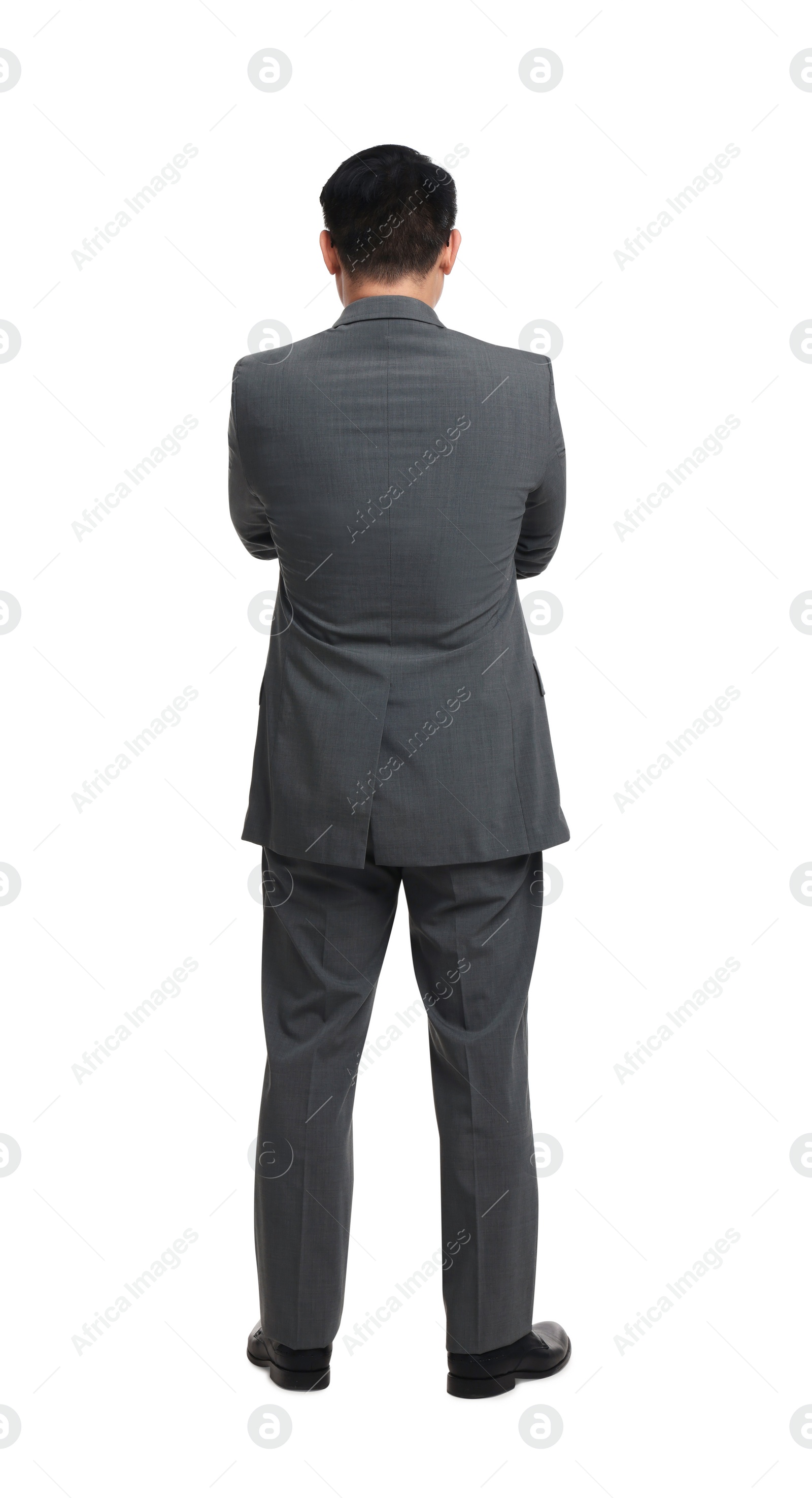 Photo of Businessman in suit posing on white background, back view