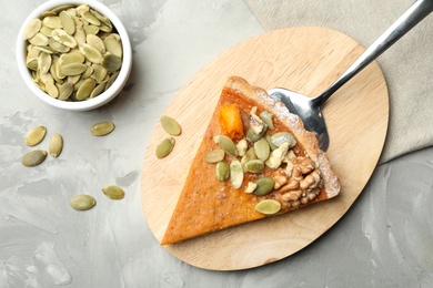 Image of Piece of fresh homemade pumpkin pie on marble table, flat lay