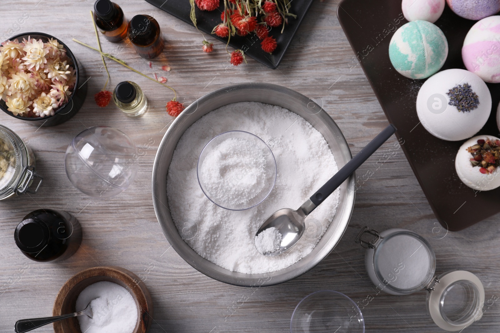 Photo of Flat lay composition with bath bomb ingredients on wooden table