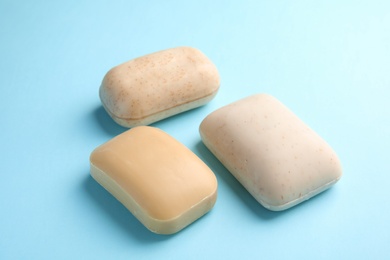 Photo of Different soap bars on color background. Personal hygiene