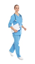 Full length portrait of medical doctor with clipboard and stethoscope isolated on white
