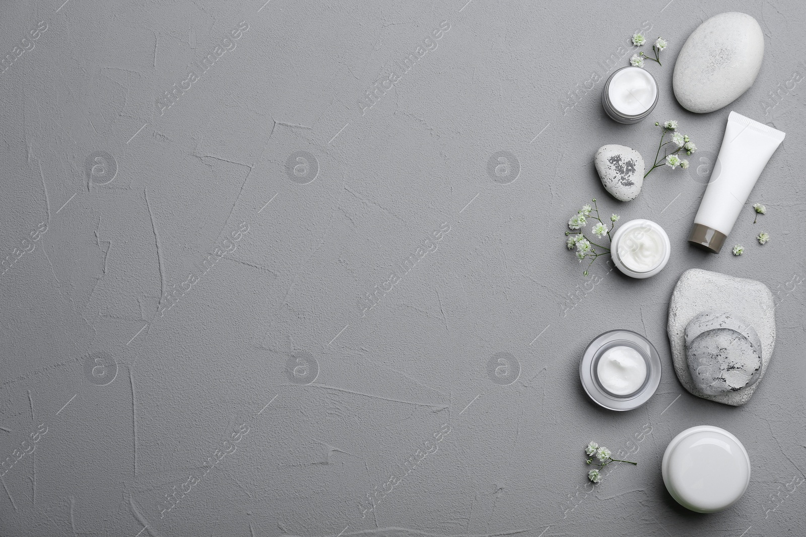 Photo of Set of natural cosmetics on grey background