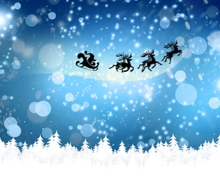 Image of Magic Christmas eve. Santa with reindeers flying in sky on snowy night