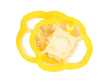 Slices of yellow bell pepper with seeds isolated on white, top view