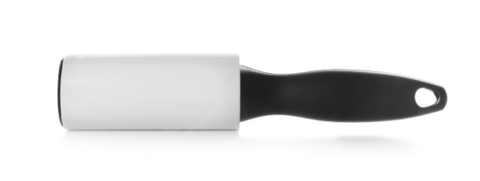 Photo of New lint roller with black handle isolated on white