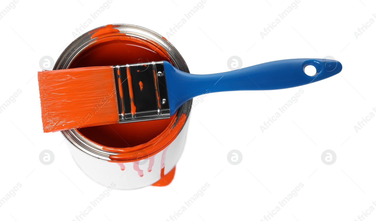 Photo of Can of orange paint and brush on white background, above view