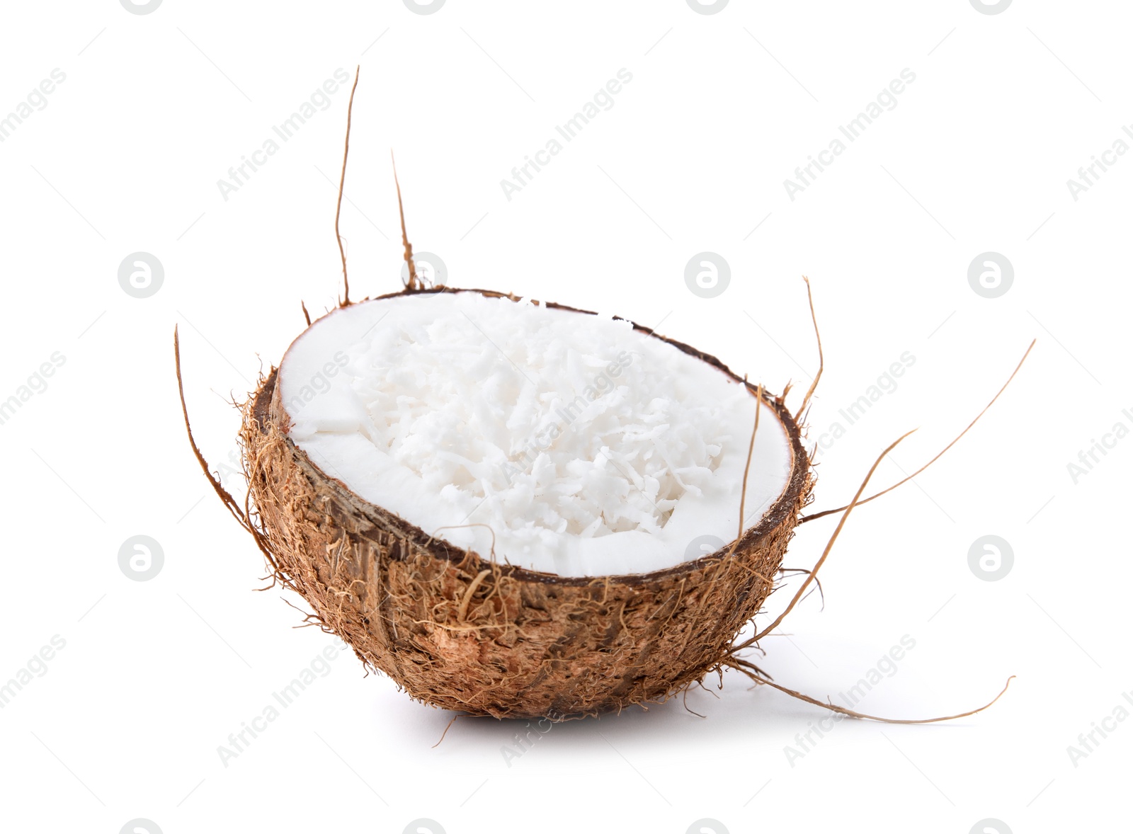 Photo of Coconut flakes in nut shell isolated on white