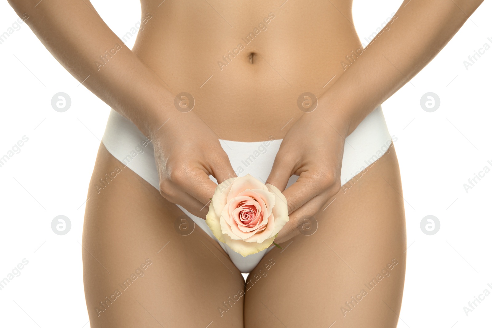 Photo of Gynecology. Woman in underwear with rose flower on white background, closeup