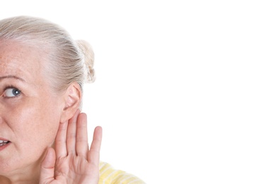 Mature woman with hearing problem on white background, closeup