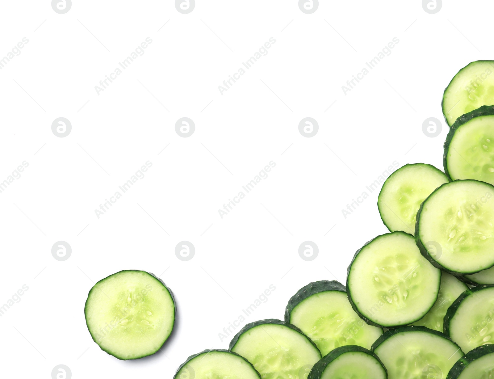 Photo of Slices of cucumbers on white background, top view