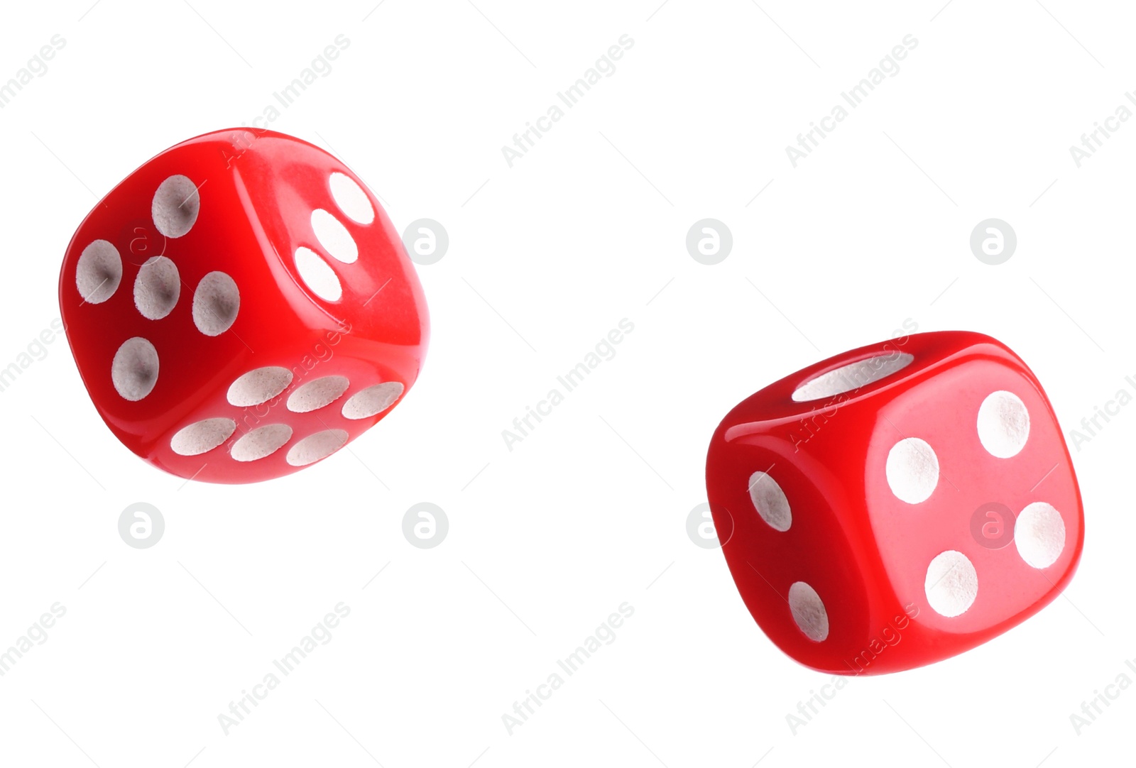 Image of Two red dice in air on white background