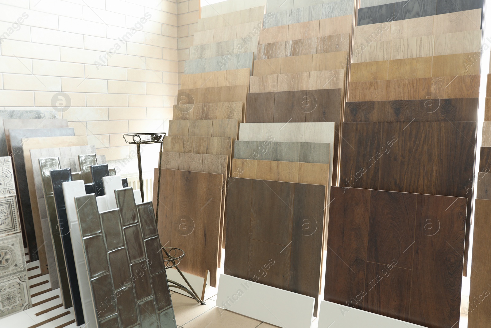 Photo of Assortment of tiles in store. Many different samples indoors