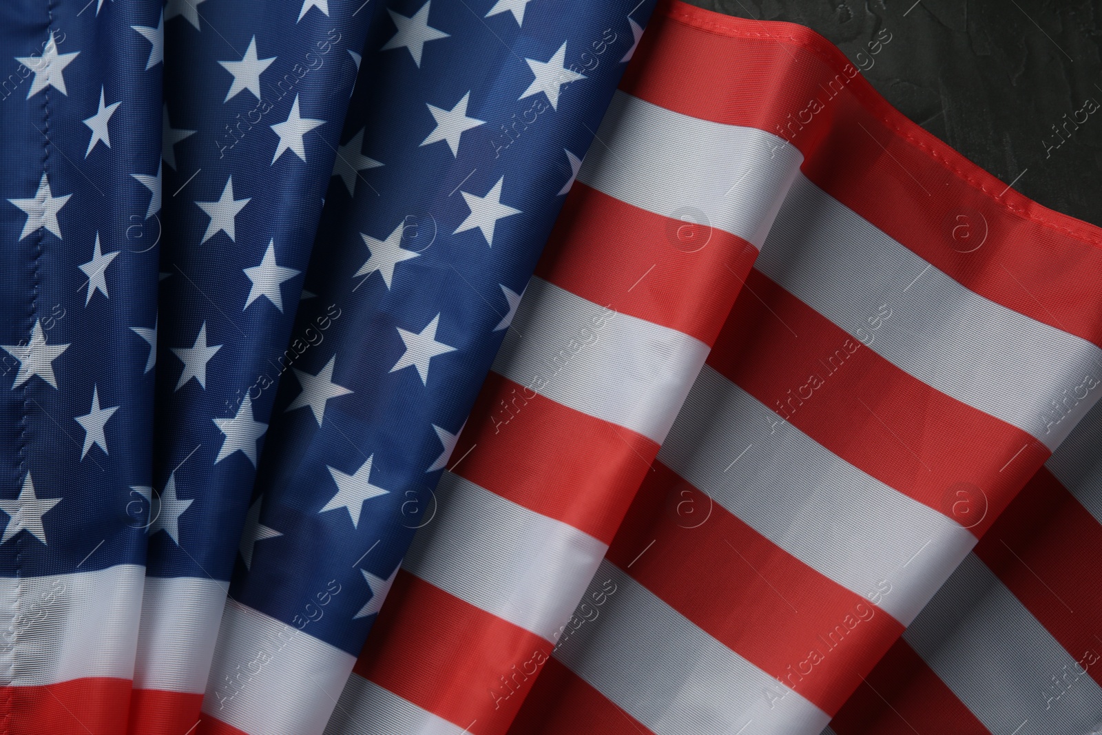 Photo of Flag of USA on black table, top view