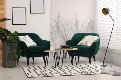 Comfortable armchairs and nesting tables in stylish room