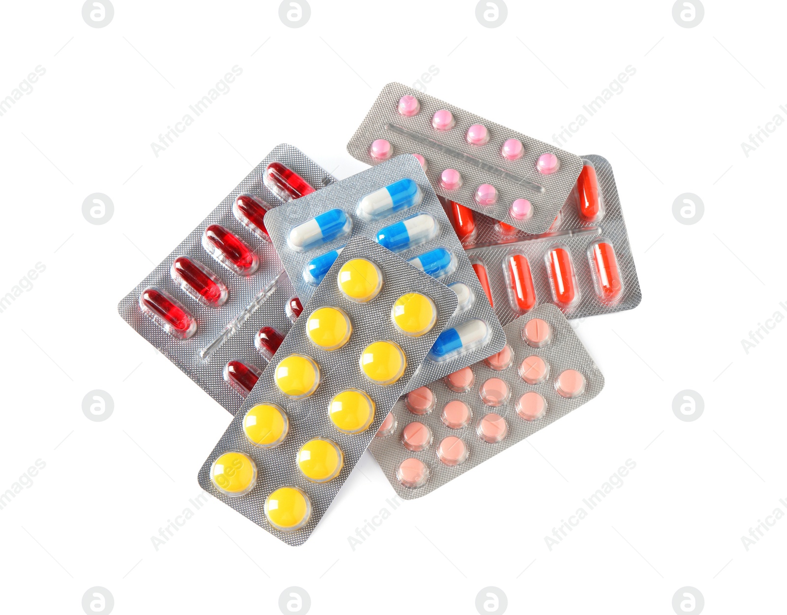 Photo of Blisters with different pills on white background, top view