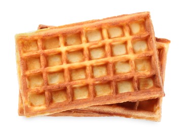 Delicious Belgian waffles on white background, top view