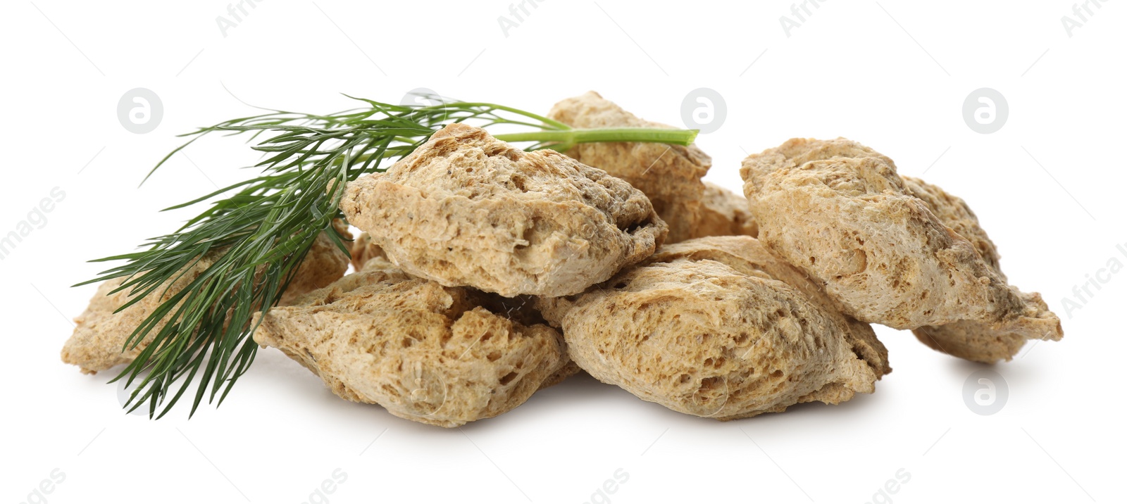 Photo of Dehydrated soy meat chunks with dill on white background